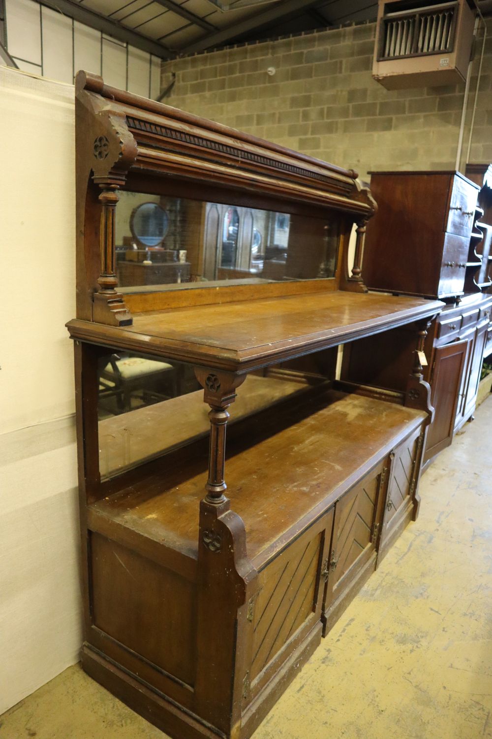 A large late Victorian oak aesthetic movement buffet sideboard, width 183cm depth 58cm height 180cm